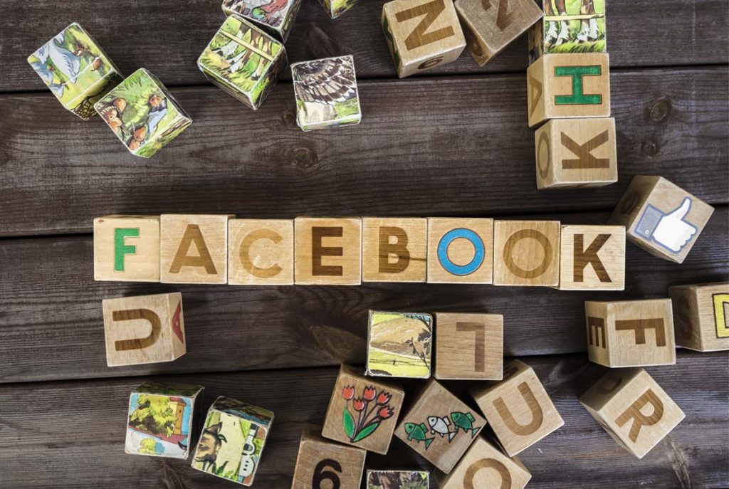 Facebook is written out in children's blocks - Charity Digital Marketing Facebook and Meta advertising services