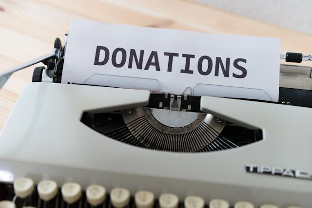 Typewriter with the word 'Donations' typed on paper. Email appeal services from Charity Digital Marketing